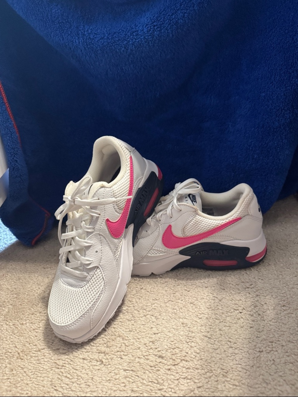 Nike White Sneakers with Pink Swoosh and Navy Accents